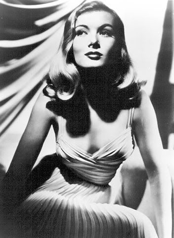  emulating actress Veronica Lake with her wave-over-one eye hairstyle.