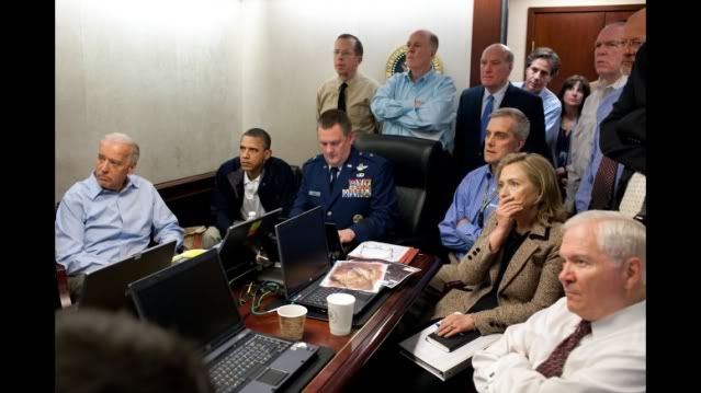 President Barack Obama and Vice President Joe Biden, along with members of the national security team, receive an update on the mission against Osama bin Laden in the Situation Room of the White House, May 1, 2011. Seated, from left, are: Brigadier General Marshall B. â��Bradâ�� Webb, Assistant Commanding General, Joint Special Operations Command; Deputy National Security Advisor Denis McDonough; Secretary of State Hillary Rodham Clinton; and Secretary of Defense Robert Gates. Standing, from left, are: Admiral Mike Mullen, Chairman of the Joint Chiefs of Staff; National Security Advisor Tom Donilon; Chief of Staff Bill Daley; Tony Binken, National Security Advisor to the Vice President; Audrey Tomason Director for Counterterrorism; John Brennan, Assistant to the President for Homeland Security and Counterterrorism; and Director of National Intelligence James Clapper. Please note: a classified document seen in this photograph has been obscured. (Official White House Photo by Pete Souza)
