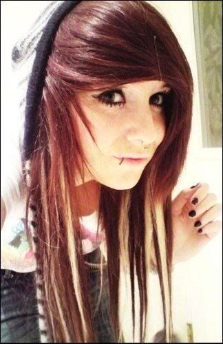 Tattoos & piercings: A nose ring in her left nostral.